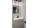 Clean and modern bathroom features a white vanity with storage, a mirror, and essential fixtures for personal care at 1327 Union St, Columbus, IN 47201