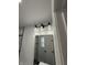 Contemporary bathroom with black fixtures, modern lighting and framed mirror at 1327 Union St, Columbus, IN 47201