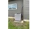 Air conditioning unit located on the side of the home. Gray siding at 1327 Union St, Columbus, IN 47201