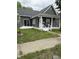 Charming home with gray siding, a new roof, and a welcoming white porch at 1327 Union St, Columbus, IN 47201