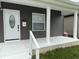 Charming home's front porch with a bright white door and updated siding at 1327 Union St, Columbus, IN 47201