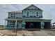 Two-story house with a two-car garage is under construction, ready for customization and finishing touches at 1335 Foxtail Ln, Greenwood, IN 46143
