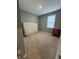 Bedroom with carpet flooring, neutral walls, and a window at 1380 Fairmount Dr, Greenfield, IN 46140