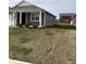 Side view of a well-maintained single-story home with a green lawn at 1380 Fairmount Dr, Greenfield, IN 46140