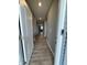 Long hallway featuring wood-look floors and neutral gray walls at 1380 Fairmount Dr, Greenfield, IN 46140