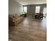 View of a open-concept living room with hardwood floors and plenty of natural light from the windows at 1380 Fairmount Dr, Greenfield, IN 46140