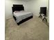 Simple bedroom design with a bed and entertainment center at 142 Winding Brook Way, Pendleton, IN 46064