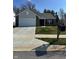 Charming single-story home featuring a well-maintained lawn, brick accents, and a two-car garage at 142 Winding Brook Way, Pendleton, IN 46064
