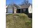 Well-kept single-story home with manicured lawn, brick accents, and attached two-car garage at 142 Winding Brook Way, Pendleton, IN 46064