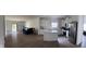 Open concept living area features a kitchen, and access to the backyard through a sliding glass door at 142 Winding Brook Way, Pendleton, IN 46064