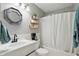 This bathroom is all white with black hardware at 14634 Village Park East Dr, Carmel, IN 46033