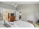 This bright bedroom features wood floors, neutral walls, and views into the living room and bathroom at 14634 Village Park East Dr, Carmel, IN 46033