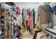Walk-in closet featuring shoe organizers, clothes racks and shelving for storage at 14634 Village Park East Dr, Carmel, IN 46033