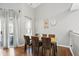 Bright dining room featuring hardwood floors, neutral paint and a view to the outdoor patio at 14634 Village Park East Dr, Carmel, IN 46033