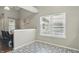Additional dining area with large windows providing natural light and stylish flooring at 14634 Village Park East Dr, Carmel, IN 46033