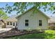 Well-maintained home exterior with manicured landscaping and a spacious backyard, showcasing curb appeal at 14634 Village Park East Dr, Carmel, IN 46033