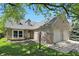 Charming brick home with a well-manicured lawn and an attached two-car garage at 14634 Village Park East Dr, Carmel, IN 46033