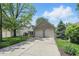 Front exterior of home featuring a two-car garage and driveway at 14634 Village Park East Dr, Carmel, IN 46033