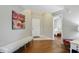 Inviting foyer with wood floors, neutral paint and view to bedroom at 14634 Village Park East Dr, Carmel, IN 46033