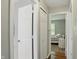 Hallway showcasing doorways to bedrooms, featuring carpet flooring and light neutral walls at 14634 Village Park East Dr, Carmel, IN 46033