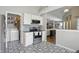 Kitchen with stainless appliances and eat-in area, adjacent to a laundry room and Gathering room at 14634 Village Park East Dr, Carmel, IN 46033