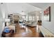 Bright living room with hardwood floors, fireplace, and an open layout at 14634 Village Park East Dr, Carmel, IN 46033
