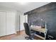 This home office has a chalkboard wall and closet at 14634 Village Park East Dr, Carmel, IN 46033