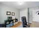This home office offers natural light and gray walls with hardwood floors at 14634 Village Park East Dr, Carmel, IN 46033