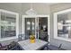 Relaxing outdoor patio space with a table, chairs, and a view into the cozy living room at 14634 Village Park East Dr, Carmel, IN 46033