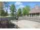 Wonderful outdoor patio, with a fire pit, offering an inviting space for entertaining in the beautifully landscaped backyard at 14634 Village Park East Dr, Carmel, IN 46033
