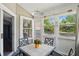 This sunroom is surrounded by windows and offers a view of the outside world at 14634 Village Park East Dr, Carmel, IN 46033