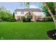 Large backyard with lush lawn, mature trees, and a deck perfect for entertaining at 14707 Thor Run Dr, Fishers, IN 46040