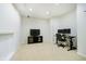 Versatile finished basement space with entertainment center and home office setup at 14707 Thor Run Dr, Fishers, IN 46040