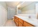 Bathroom with a double sink vanity, a large mirror and wainscoting adding traditional charm and functionality at 14707 Thor Run Dr, Fishers, IN 46040