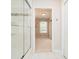 Elegant bathroom with a glass-enclosed shower and a view into an adjacent room at 14707 Thor Run Dr, Fishers, IN 46040
