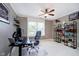 Spacious bedroom with a ceiling fan, bright windows, and desk; an ideal workspace for work or study at 14707 Thor Run Dr, Fishers, IN 46040