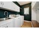 Well-equipped laundry room with modern appliances and ample counter space for efficient laundry tasks at 14707 Thor Run Dr, Fishers, IN 46040