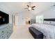 Spacious main bedroom features vaulted ceiling, dresser and sitting area and an ensuite bathroom at 14707 Thor Run Dr, Fishers, IN 46040