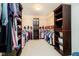 Large walk-in closet with ample shelving and hanging space for clothes, shoes, and accessories at 14707 Thor Run Dr, Fishers, IN 46040