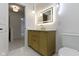 Bathroom showcasing modern vanity, illuminated mirror, and pendant lighting at 16 Maplecrest Dr, Carmel, IN 46033