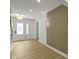 Bright entryway featuring hardwood floors, a decorative wall, and a staircase at 16 Maplecrest Dr, Carmel, IN 46033