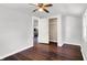 Well-lit bedroom with hardwood floors, neutral walls, and a closet at 1610 S F St, Elwood, IN 46036