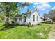 Charming two-story home with white siding and a well-maintained lawn in a residential neighborhood at 1610 S F St, Elwood, IN 46036