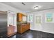 Bright kitchen with wooden cabinets, laminate countertops and tile backsplash at 1610 S F St, Elwood, IN 46036