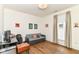 Bright bedroom featuring hardwood floors, a daybed, desk and a large window for natural light at 1630 N New Jersey St, Indianapolis, IN 46202