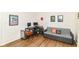 Bedroom featuring hardwood floors, day bed with pillows, desk, office chair and two computer monitors at 1630 N New Jersey St, Indianapolis, IN 46202