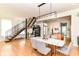 Open dining room with views of staircase, kitchen and modern furnishings, with stylish decor at 1630 N New Jersey St, Indianapolis, IN 46202