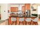 Stylish kitchen island with seating, granite countertop, stainless steel appliances, and ample storage at 1630 N New Jersey St, Indianapolis, IN 46202