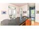 Gourmet kitchen with granite countertops, stainless steel sink, and ample sunlight from patio doors at 1630 N New Jersey St, Indianapolis, IN 46202