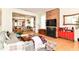 Inviting living room with exposed brick fireplace and open layout to dining area and kitchen at 1630 N New Jersey St, Indianapolis, IN 46202